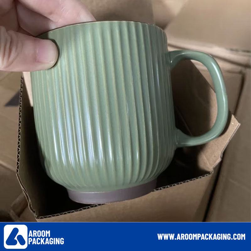 Brown Cardboard Box of Green Ceramic Mug